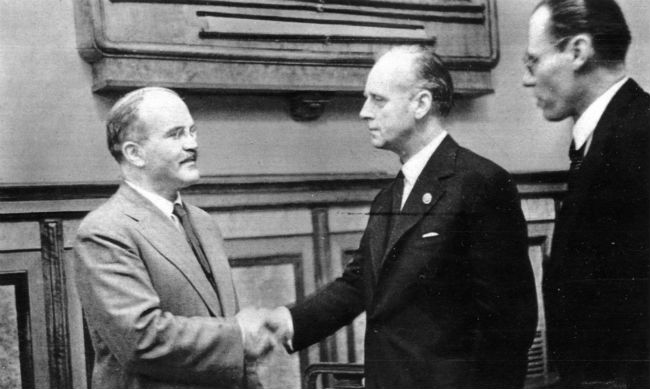 Molotov and Ribbentrop shaking hands after signing the pact.