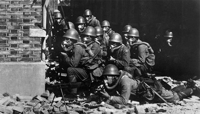 Japanese Special Naval Landing Forces with gas masks and rubber gloves during a chemical attack near Chapei in the Battle of Shanghai.