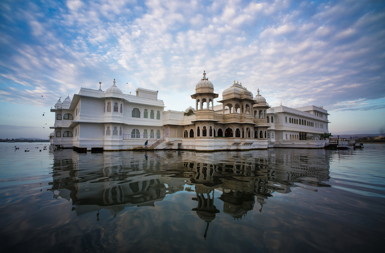 The Lake Palace is a beautiful white marble palace located in the middle of Lake Pichola